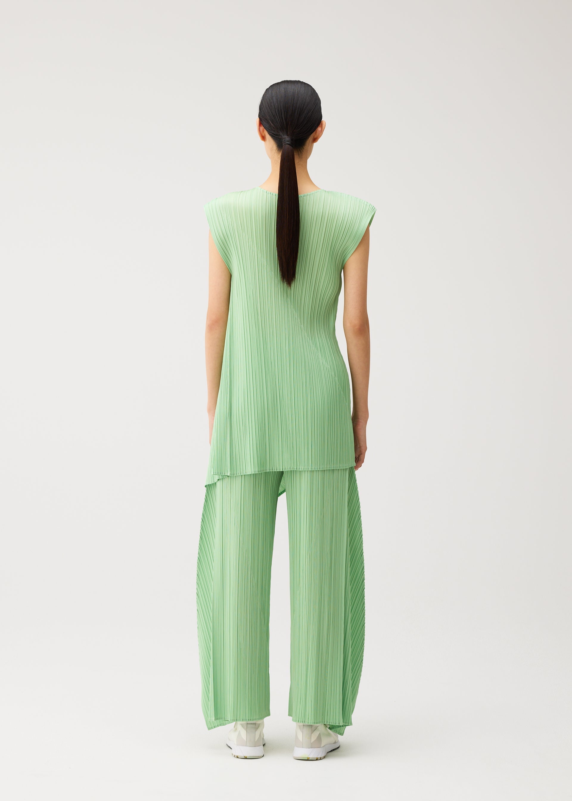 A model wears the PLEATS PLEASE ISSEY MIYAKE FOLD fold-dress-black-1.