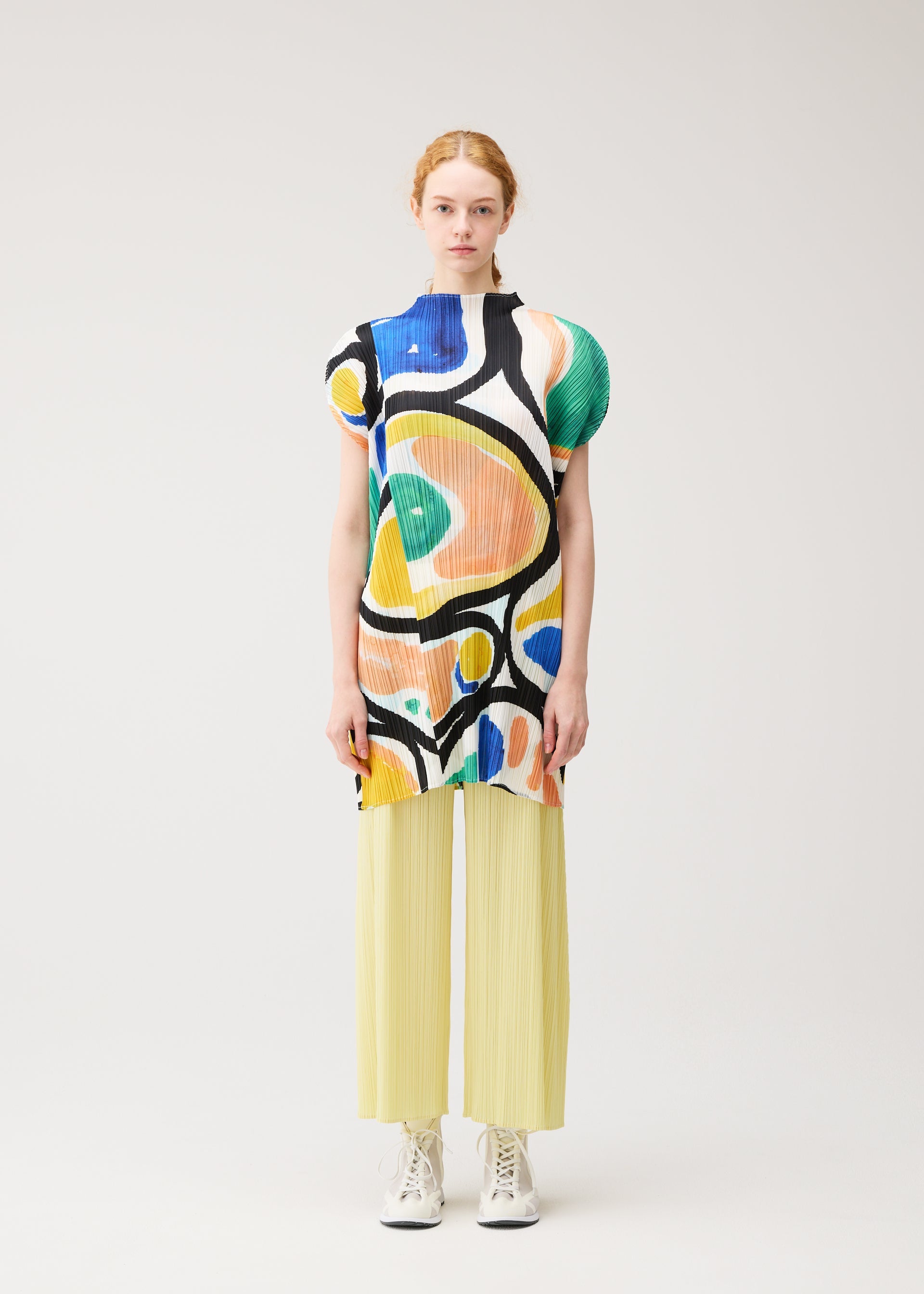 A model wears the PLEATS PLEASE ISSEY MIYAKE ROLL roll-dress-multi-3.