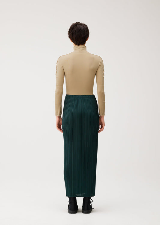 A model wears the PLEATS PLEASE ISSEY MIYAKE A-POC SKIN shirt.