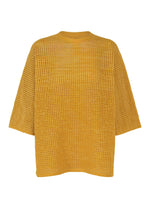A product shot of the PLEATS PLEASE ISSEY MIYAKE DOT KNIT shirt in ocher.