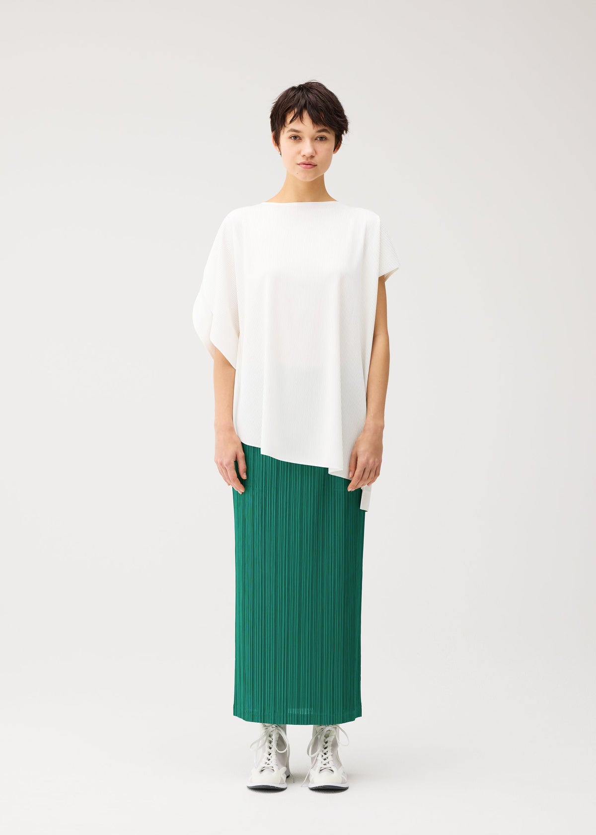 A model wears the PLEATS PLEASE ISSEY MIYAKE A-POC SLICE a-poc-slice-shirt-white-2.