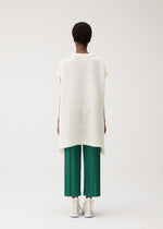 A model wears the PLEATS PLEASE ISSEY MIYAKE PAPER BOUNCE KNIT paper-bounce-knit-shirt-black-3.
