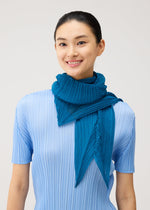 A model wears the PLEATS PLEASE ISSEY MIYAKE FOLD HOOD SCARF fold-hood-scarf-stole-cerulean-blue.