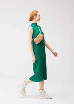 A model wears the PLEATS PLEASE ISSEY MIYAKE BIAS PLEATS WAIST BAG bias-pleats-waistbag-bag-black-fw26.