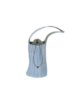 A product shot of the PLEATS PLEASE ISSEY MIYAKE PLEATS SWAN BAG bag in light blue.