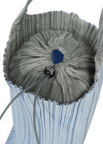A detail shot of the PLEATS PLEASE ISSEY MIYAKE PLEATS SWAN BAG bag.