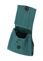A detail shot of the PLEATS PLEASE ISSEY MIYAKE PLEATS KNAPSACK bag.