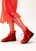 A model wears the PLEATS PLEASE ISSEY MIYAKE WOW! SOCKS socks.